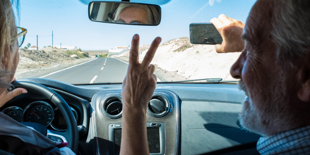 Older Couple Taking A Selfie on a Roadtrip